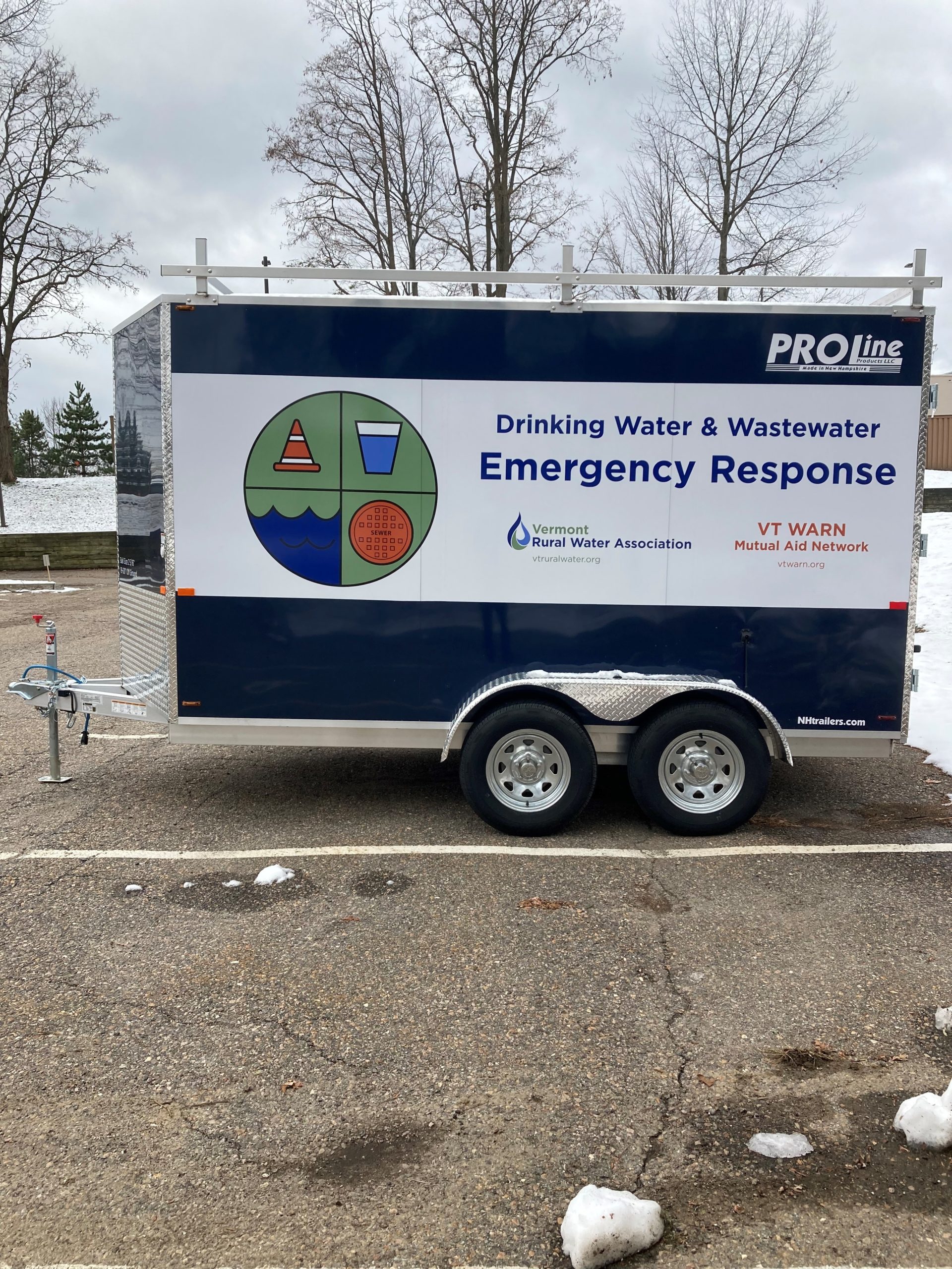 A navy blue trailer that says "Drinking Water & Wastewater Emergency Response"