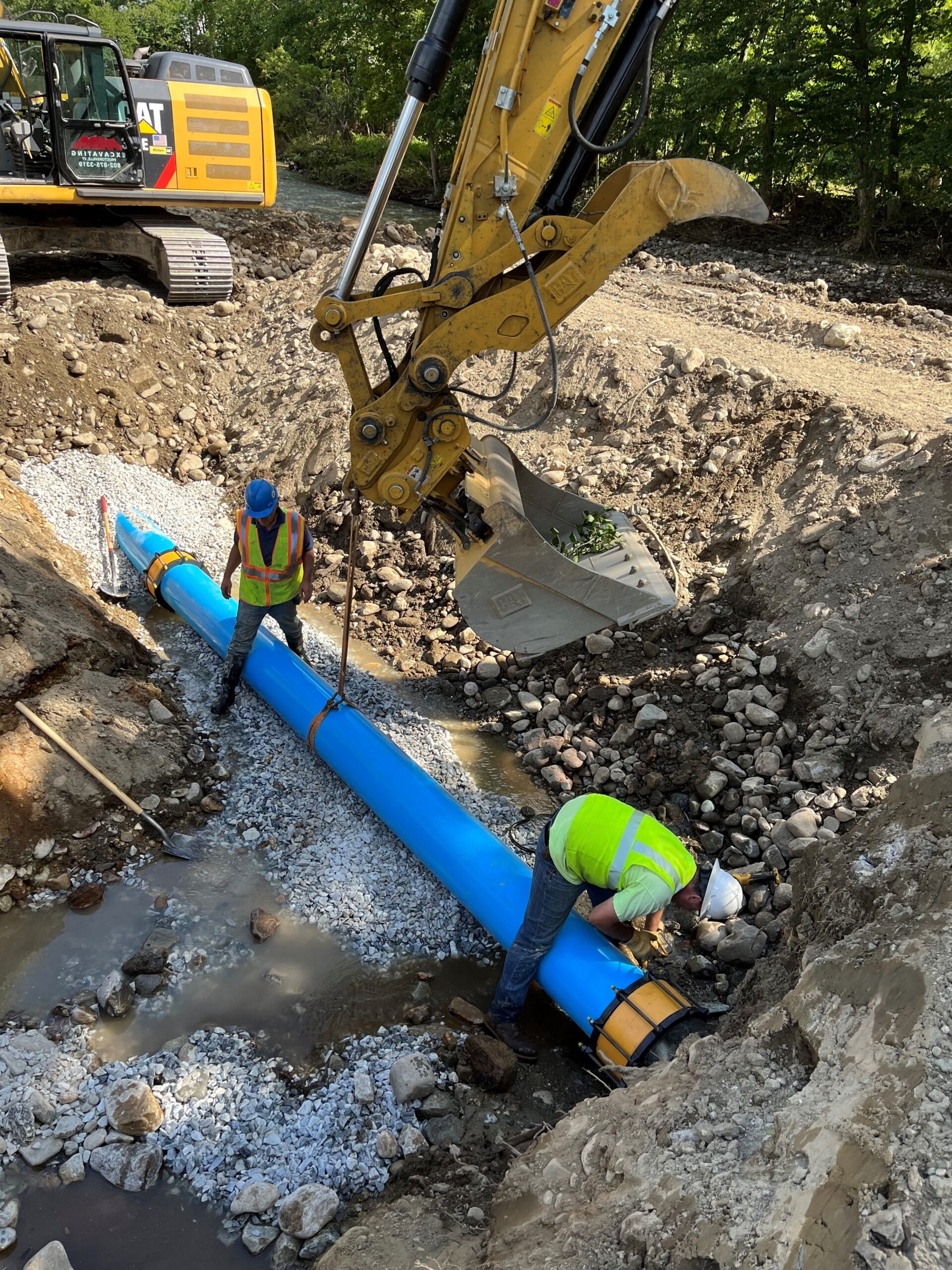 People sit around a U-shaped table facing a slide show